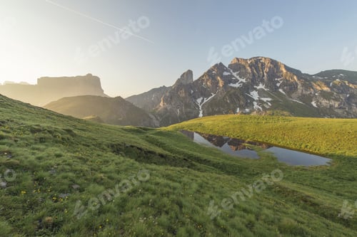Preview: Alpine Lake And Reflection Of The Mountain In It. Dolomites High Alpine Peaks Reflection In The