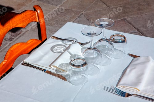Preview: Glasses On White Tablecloth On Outdoor Terrace