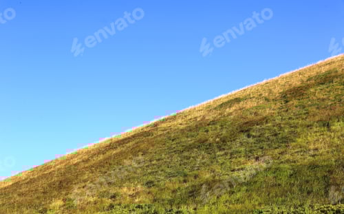 Preview: Green Mountain Slope Under Blue Sky
