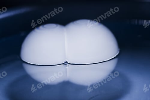Preview: Abstract Shot With Big Soap Bubbles On A Water Surface With Smoke Inside. Image Has Grain Texture