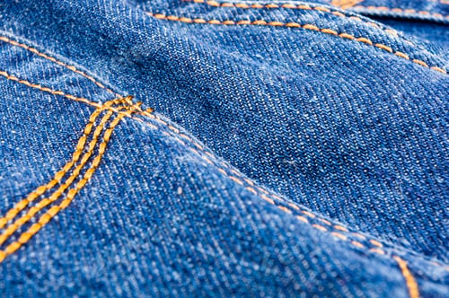 Preview: Clothing Items Blue Stonewashed Faded Jeans Cotton Fabric Texture With Seams, Clasps, Buttons And