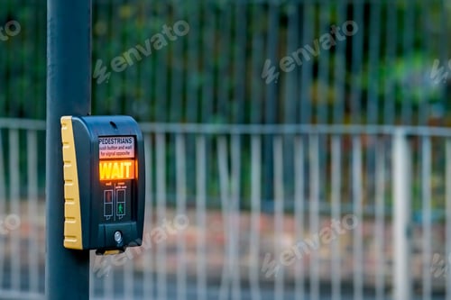 Preview: Pedestrian Button With Wait Signal Lit Up At A Pedestrian Crossing In London, Uk