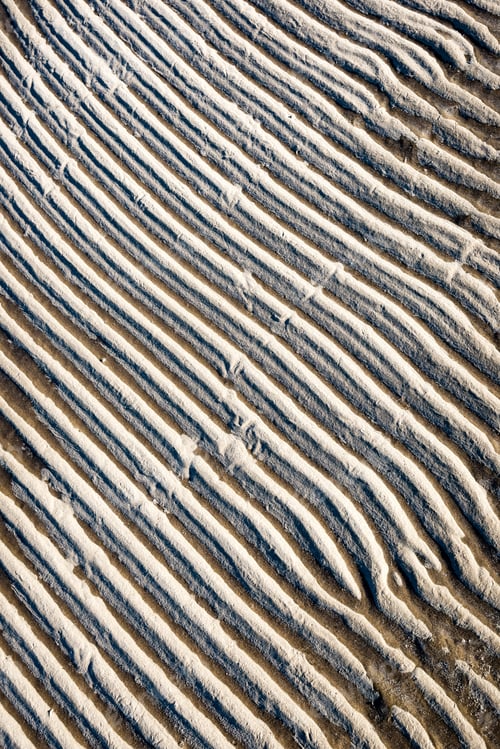 Preview: Frozen Sand With Ice Blocks. Abstract Texture In Natural Beach