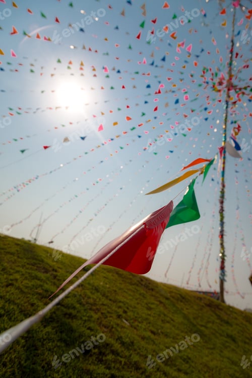 Preview: Multi-Color Triangle Pray Flags At Thai Celebration Festival With Cloud And Blue Sky Background