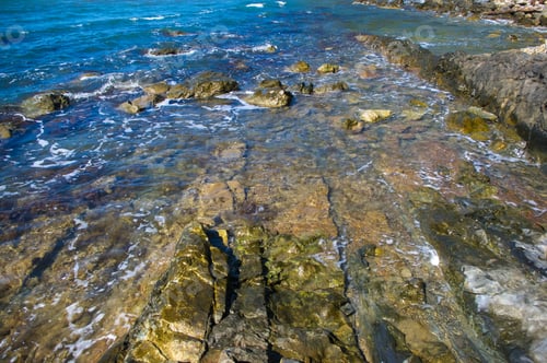 Preview: Rocky Sea Shore With Pebble Beach, Transparent Waves With Foam, On A Warm Summer Day