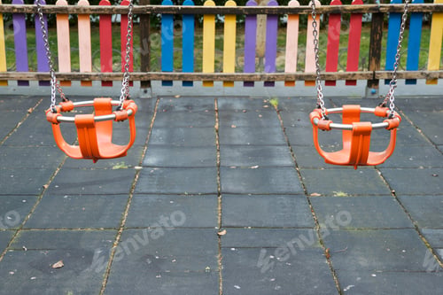 Preview: Empty Swings In A Playground.