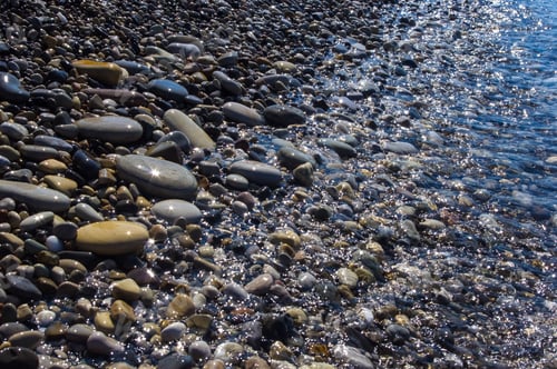 Preview: Sea Pebble Beach With Multicoloured Stones, Transparent Waves With Foam, On A Warm Summer Day