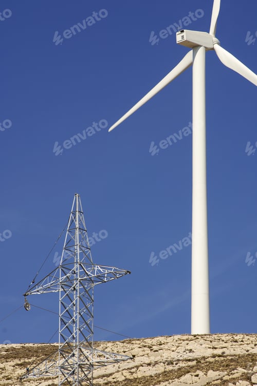 Preview: Windmill And High Voltage Tower In A Hill