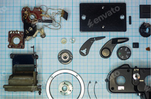 Preview: Parts Old Retro Film Slr Camera On Graph Paper