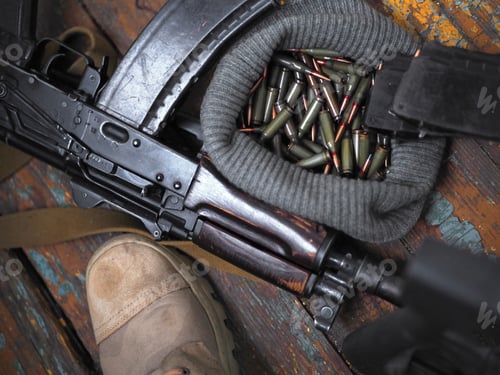 Preview: Soldier Boots And Handgun. War. Close Up Photo.