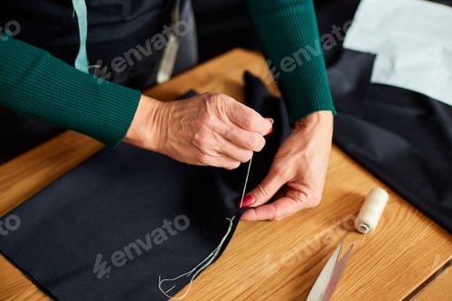 Preview: Top View Step By Step, 50-Yers Old Woman Sewing Fabric With Hand, Mature Tailor Working With Sewing