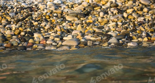 Preview: Pebble Stones On The Sea Beach, The Rolling Waves Of The Sea With Foam
