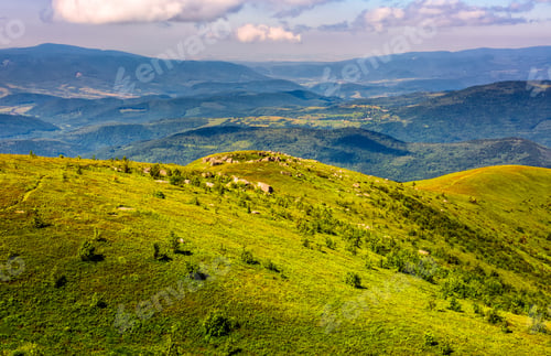 Preview: Mountain Summer Landscape. Meadow With Huge Rocks Among The Grass On Top Of The Hillside Near The