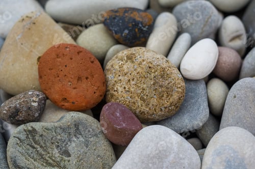 Preview: Boulders And Colorful Pebbles On The Beach