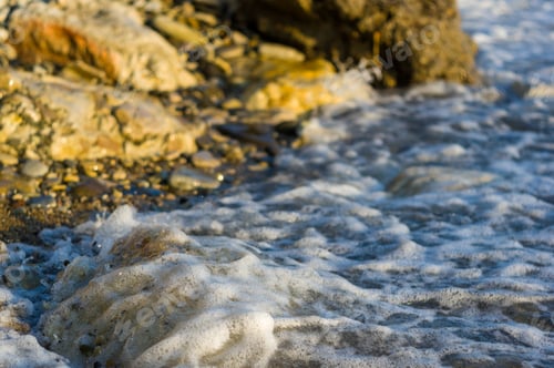 Preview: Pebble Stones On The Sea Beach, The Rolling Waves Of The Sea With Foam
