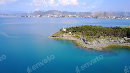 Preview: Aerial Photo Of Iconic Lighthouse In Small Vegetated Islet