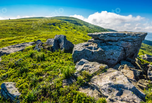 Preview: Landscape With Grassy Meadow With Giant Boulders On The Slope Of A Hill In Carpathian Mountain