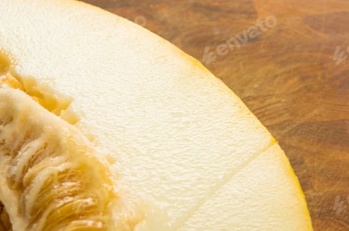 Preview: Half Of Ripe Juicy Melon On Wooden Background
