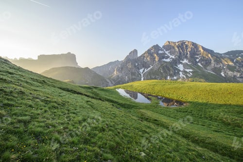 Preview: Alpine Lake And Reflection Of The Mountain In It. Dolomites High Alpine Peaks Reflection In The