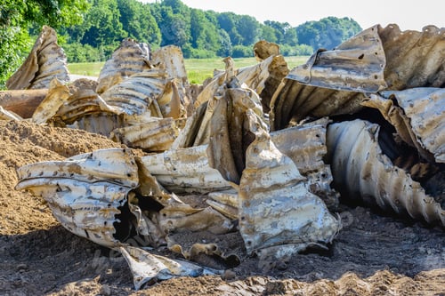 Preview: Closeup Of Old And Dirty Corrugated Steel Distorted And Piled In A Nature Reserve.