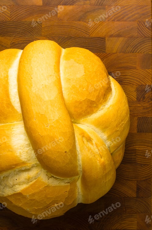 Preview: Fresh Braided Loaf Of White Wheat Bread On Wooden Background