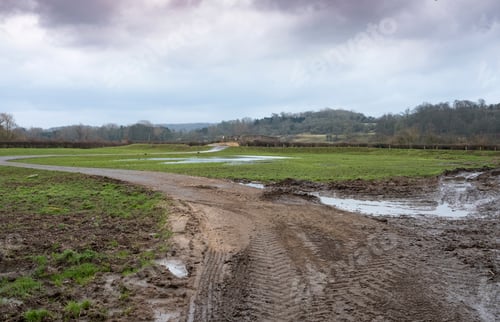 Preview: Muddy Farm Road And Distant Bridge
