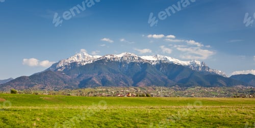 Mountain Landscape View over Green Grassy Field