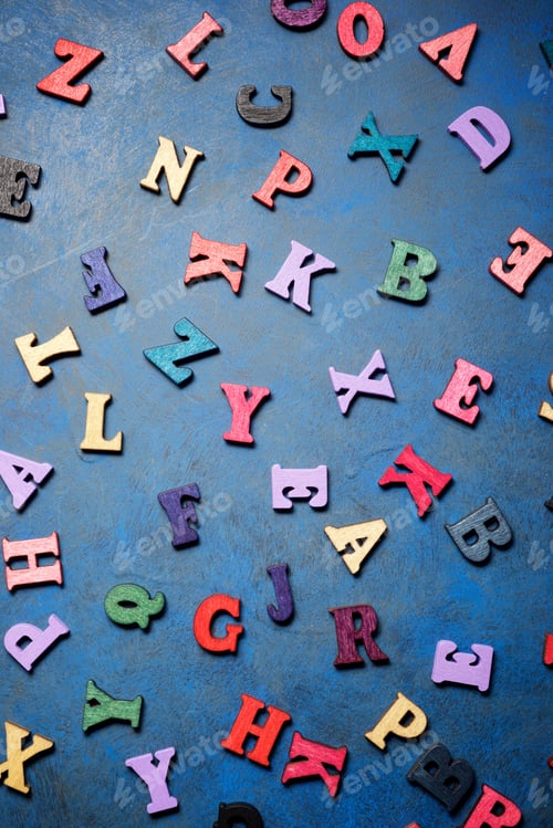 Preview: Wood Letters On A Blue Table.