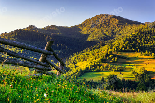 Preview: Wooden Fence In The Grass On The Hillside