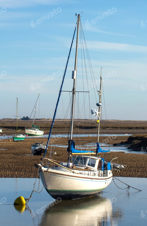 Preview: Small Motor Boat Stranded At Low Tide At Wells Next The Sea, Norfolk, Uk