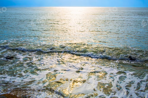 Preview: The Water Surface Lit With The Sunset Sun