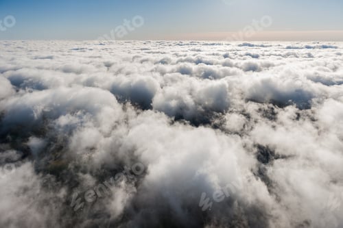 Preview: Aerial View From Airplane Over The Clouds And Sky