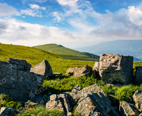 Preview: Huge Boulders On A Grassy Hillside At Sunrise. Gorgeous Mountain Landscape With Beautiful Sky