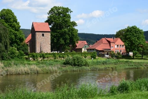 Preview: The Idyllic Village Hemeln At The River Weser With Medieval Church Tower