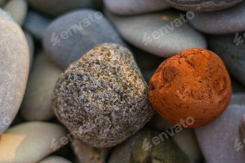 Preview: Boulders And Colorful Pebbles On The Beach