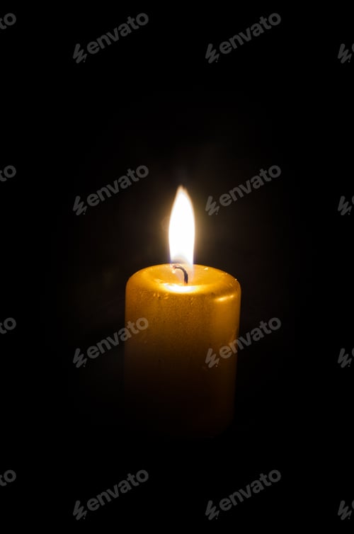 Preview: One Burning Candle Decoration Against Black Background