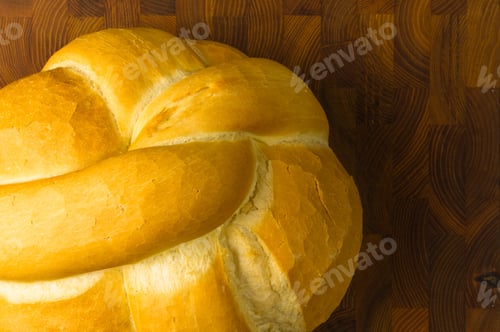 Preview: Fresh Braided Loaf Of White Wheat Bread On Wooden Background
