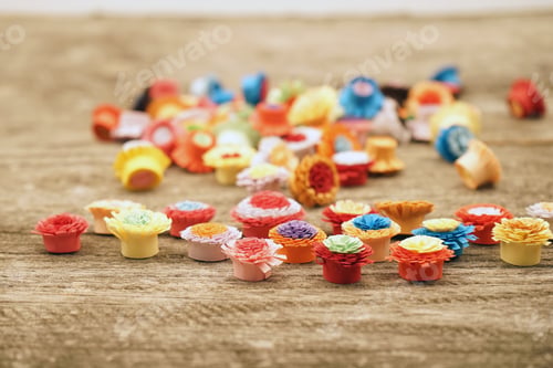 Preview: Small, Colorful Paper Flowers Made With Quilling Technique On A Wooden Surface