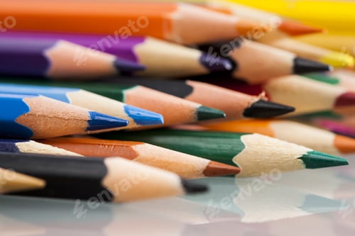 Preview: Group Of Sharp Colored Pencils With White Background And Reflexions