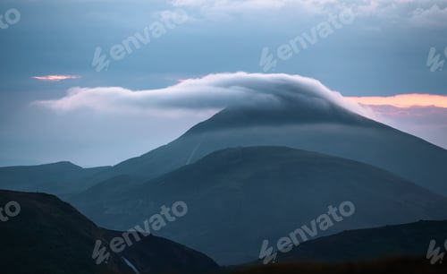 Preview: From The Mountain Valley Opens The Captivating Scene With The Sunset. High Mountain With A Peak In