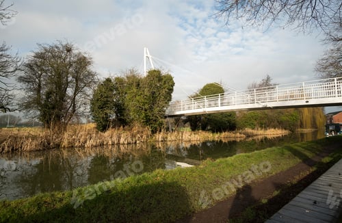 Preview: White Footbridge Crossing A Canal
