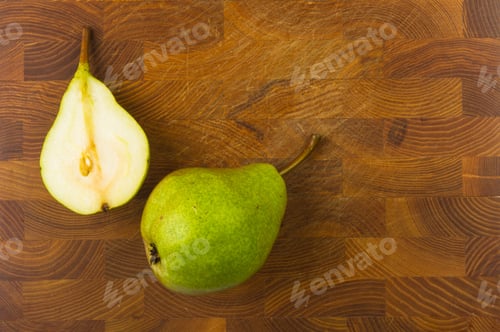 Preview: Colorful Pears And Slices On A Wooden Background