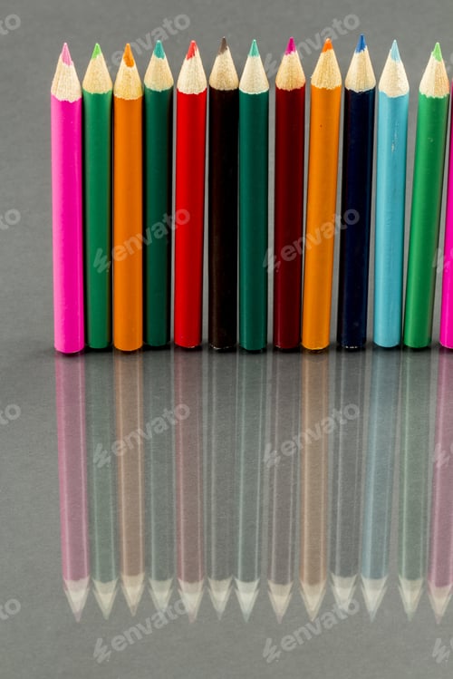 Preview: Group Of Sharp Colored Pencils With Reflexions On Dark Background