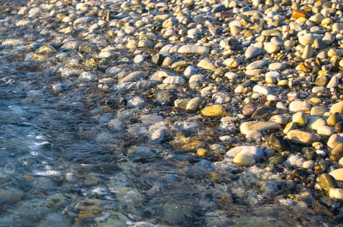 Preview: Sea Pebble Beach With Multicoloured Stones, Transparent Waves With Foam, On A Warm Summer Day