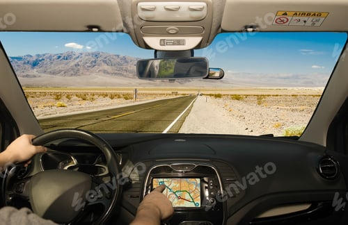 Preview: Driving A Car While Using The Touch Screen Of A Gps Navigation System On A Hot Desert Road In Death