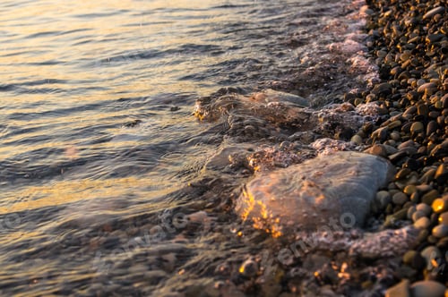 Preview: Sea Pebble Beach With Multicoloured Stones, Transparent Waves With Foam, On A Warm Evening