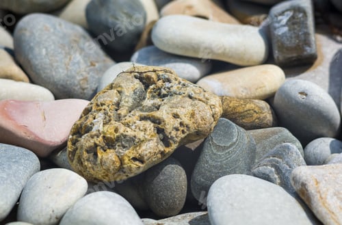 Preview: Boulders And Colorful Pebbles On The Beach
