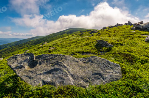 Preview: Landscape With Grassy Meadow With Giant Boulders On The Edge Of A Hill. Carpathian Mountain Ridge