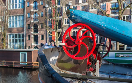Preview: Red Hand Wheel Of The Winch Of An Old Ship In A Canal In Amsterdam.