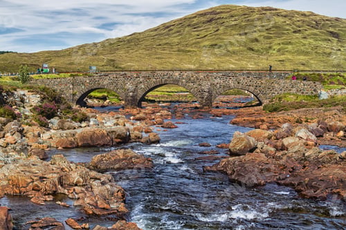 Preview: Old Vintage Brick Bridge Crossing River In Sligachan, Isle Of Skye, Scotland With Scottish